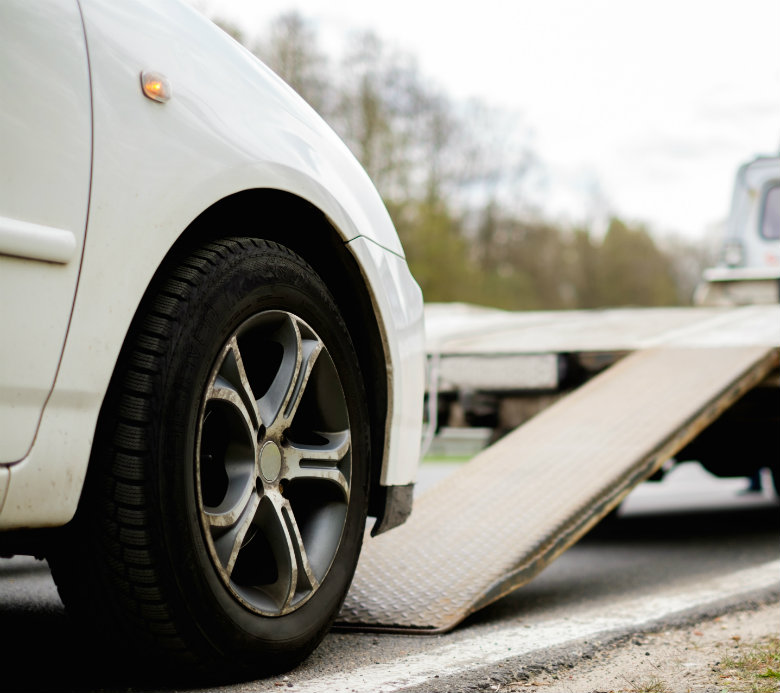 Car being loaded onto truck