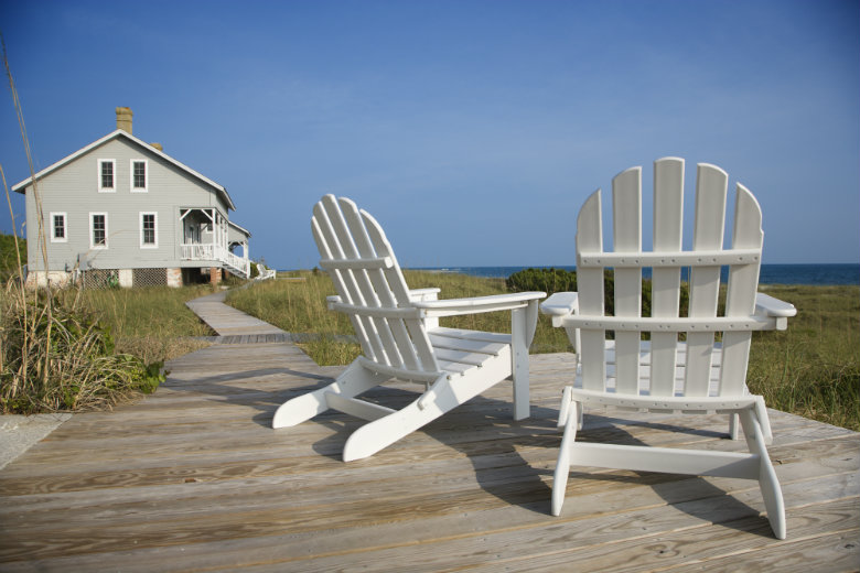 Chairs on deck overlooking beach