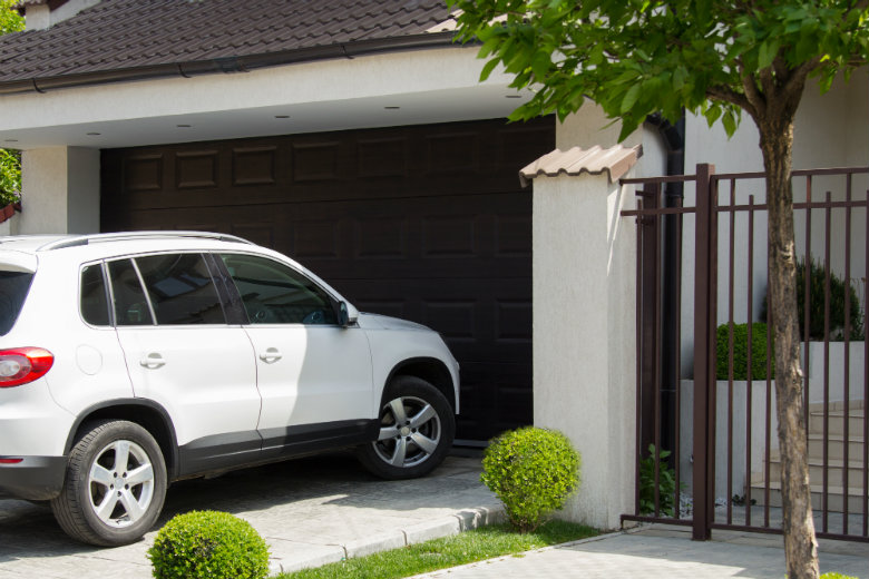 White car in front of house