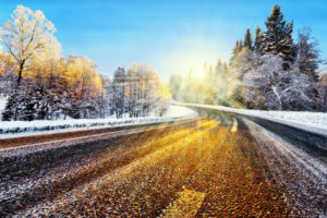 Winter road in sunlight