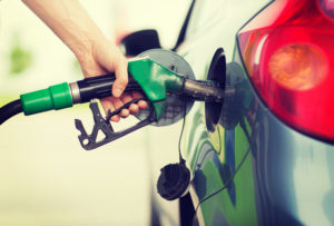 Man pumping gas into tank