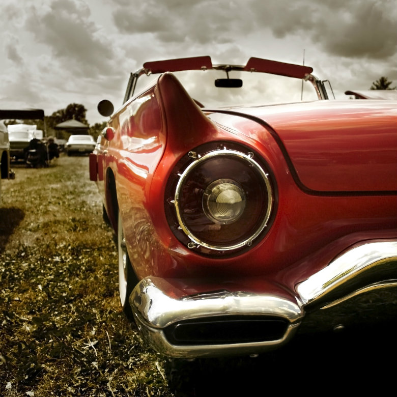 Red classic car at show