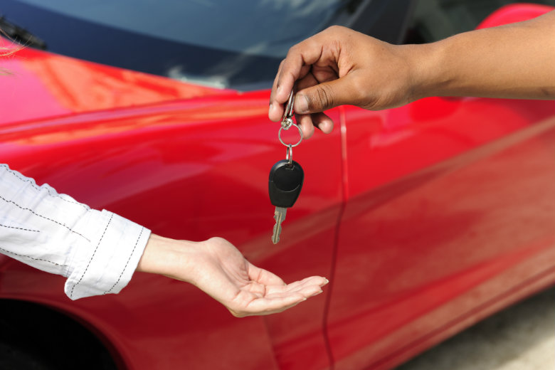 Woman receiving car key