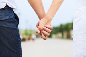 Newlyweds holding hands 