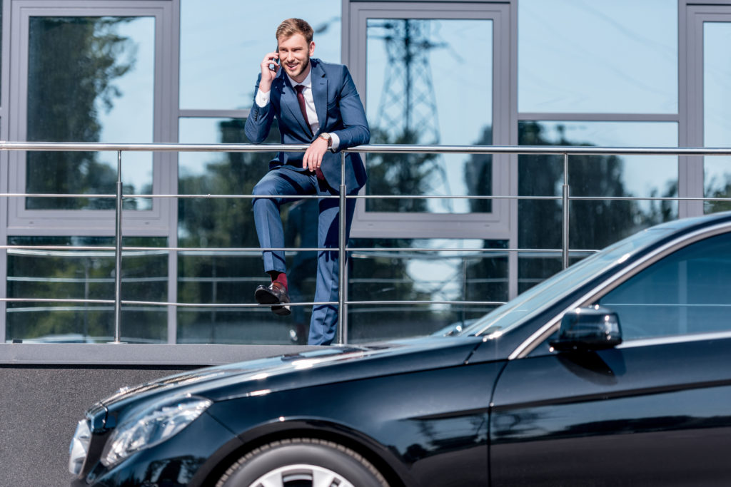 Businessman with car