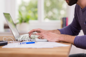 Man working on laptop computer