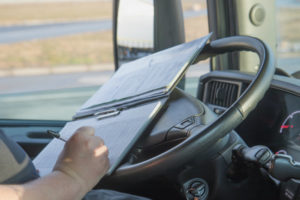 Truck Driver Filling Out Paperwork